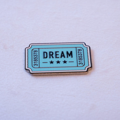 DREAM in black on an aqua admission ticket, three stars beneath and a serial number down each stub.