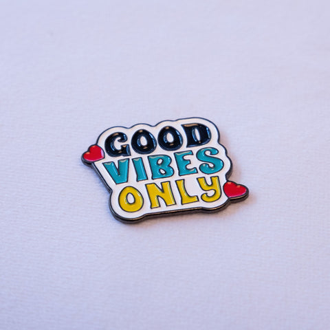 GOOD in black, VIBES in teal and ONLY in yellow on white, with two small red hearts.