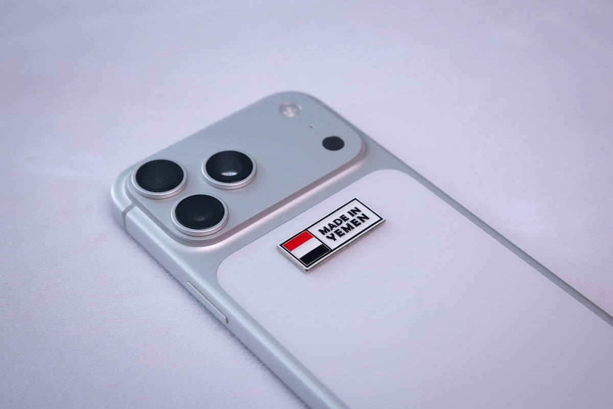The Made in Yemen flag tag sticker on the back of a phone.