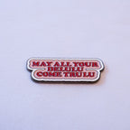 MAY ALL YOUR DELULU COME TRULU in bold red serif on a soft pink scalloped speech bubble.