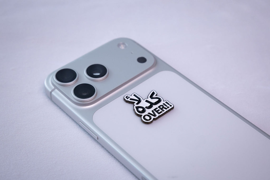 كده لأ (kida la') + "OVER!!" text sticker, applied to a phone case near the camera bump