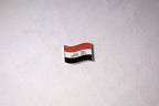 The Iraqi flag mid-wave with التكبير in green Kufic script across the white band.