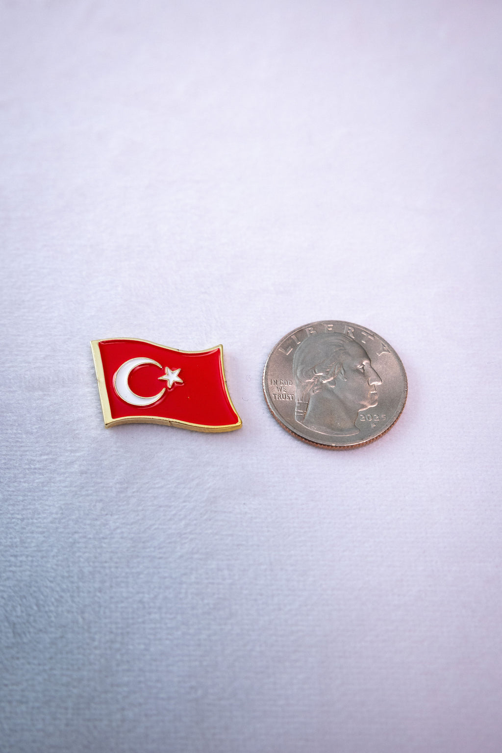 The Waving Turkey Flag sticker beside a US quarter for scale.