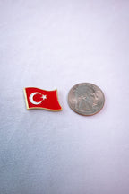 The Waving Turkey Flag sticker beside a US quarter for scale.