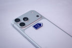 Blue Irbid (إربد) road-sign metal sticker, applied to a phone case near the camera bump