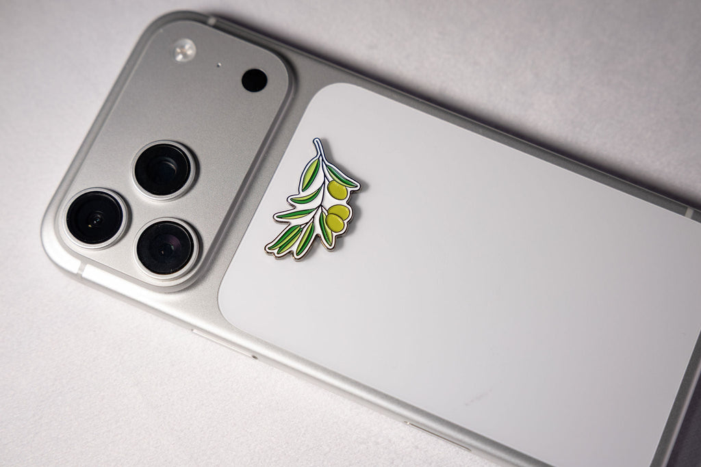 The olive branch sticker on the back of a phone.