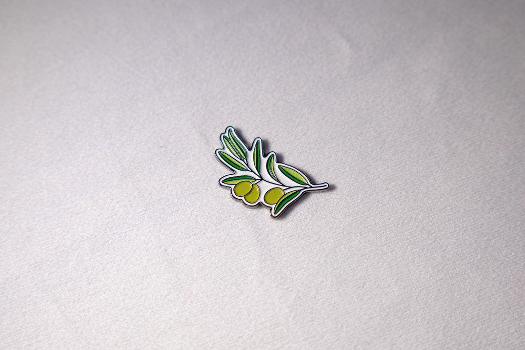 An olive branch in bare metal, leaves along a single stem.