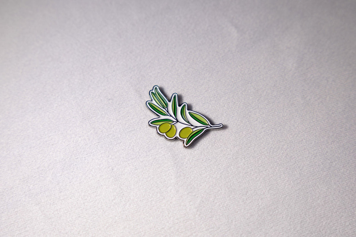 An olive branch in bare metal, leaves along a single stem.