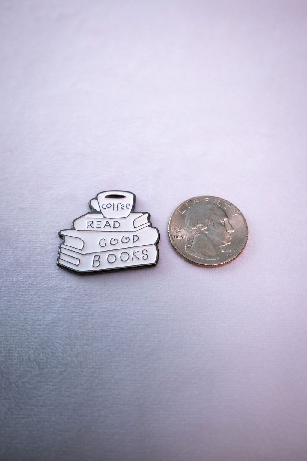 The Read Good Books sticker beside a US quarter for scale.