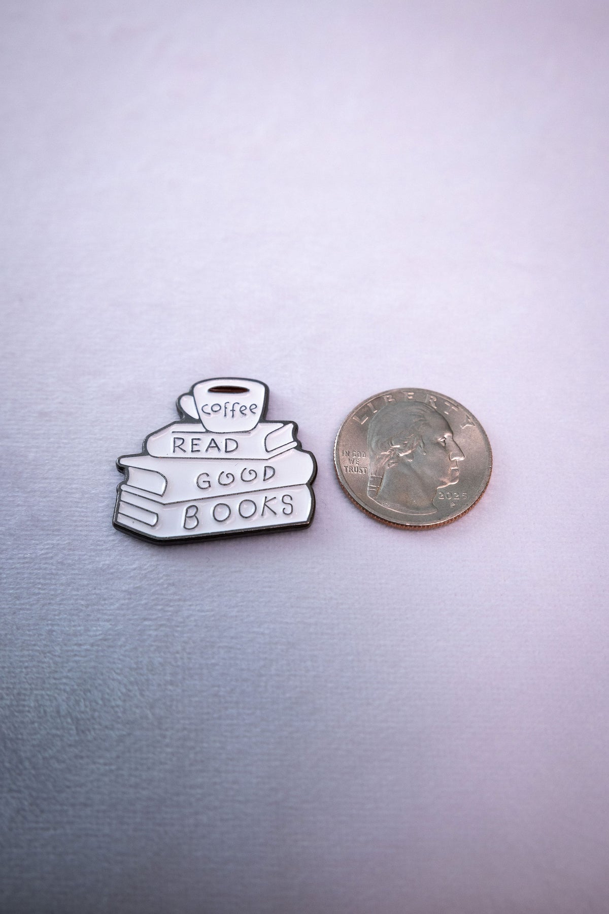 The Read Good Books sticker beside a US quarter for scale.