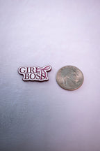 The Girl Boss sticker beside a US quarter for scale.