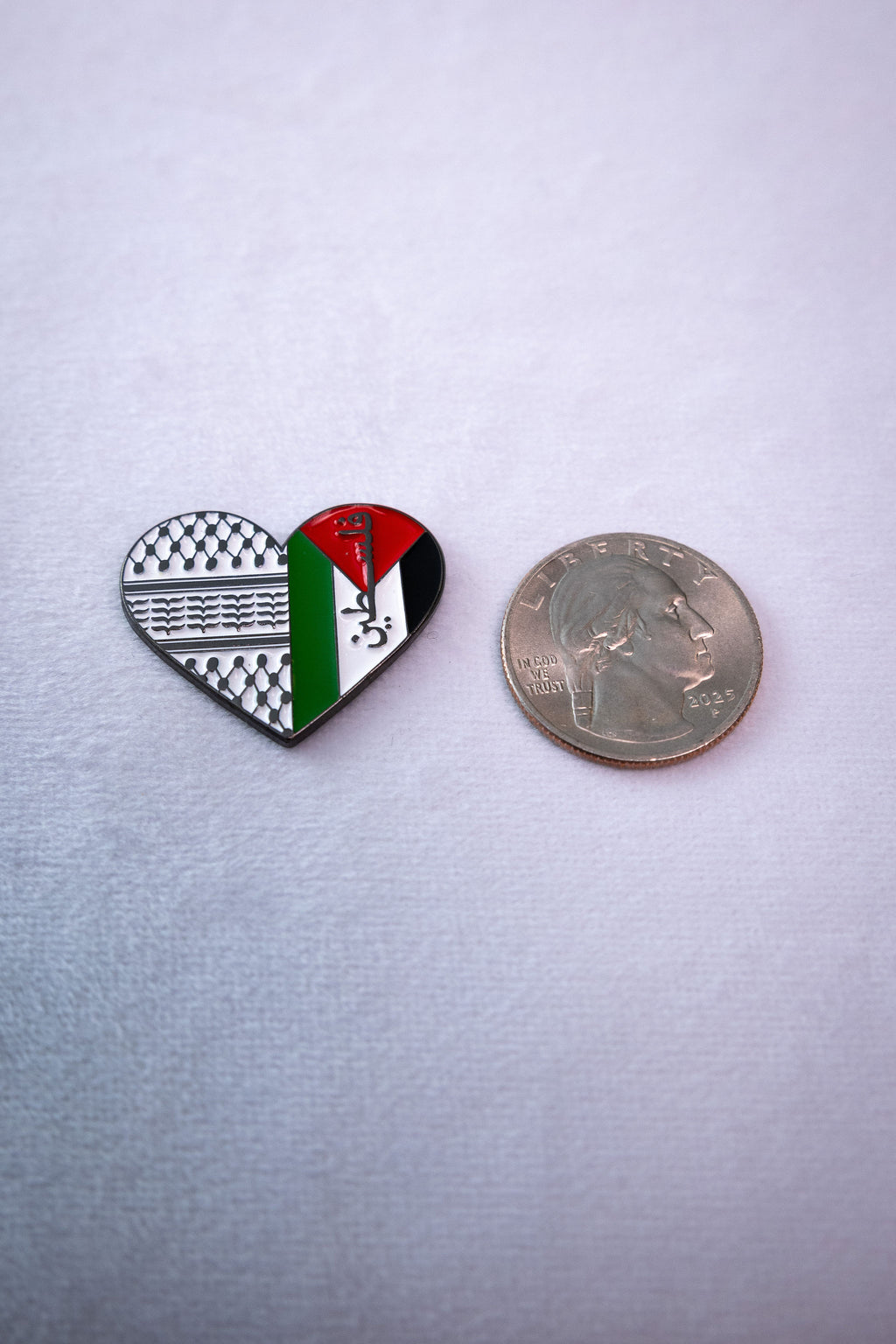 The Palestine Keffiyeh Heart sticker beside a US quarter for scale.