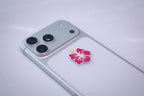 Hibiscus Flower sticker, applied to a phone case near the camera bump