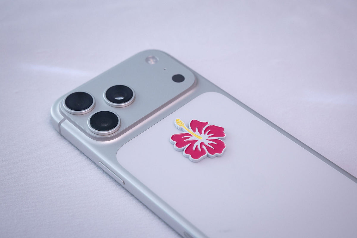 Hibiscus Flower sticker, applied to a phone case near the camera bump