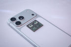The "Is it worth it? YES!" dollar bill metal sticker applied to a phone case near the camera bump.